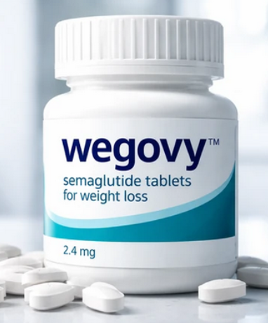 A bottle of Wegovy semaglutide tablets for weight loss, prominently featuring the brand name and dosage of 2.4 mg. Several white tablets are scattered around the bottle on a light surface, creating a clean and clinical setting. This visual contrasts with the alternative Wegovy injection for effective weight management.